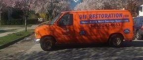 Water Damage Restoration Truck At Residential Job