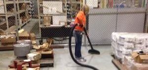 Water Damage Restoration Technician Cleaning After Flooding